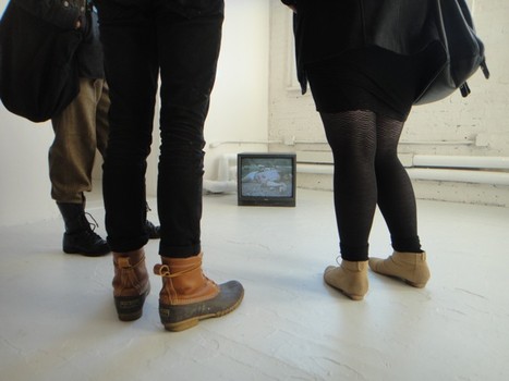 Upstairs at PS1, viewers take in the hype-saturated Laurel Nakadate exhibit.